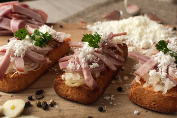 Bruschetta: homemade sheep's cheese, bacon, sauerkraut, garlic, homemade bread, herbs and spices. Italian food.