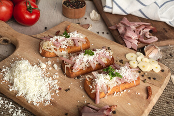 Bruschetta: homemade sheep's cheese, bacon, sauerkraut, garlic, homemade bread, herbs and spices. Italian food.