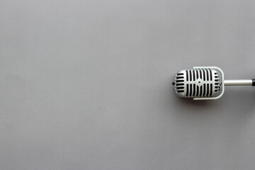 Flat lay of retro classic microphone with space for text