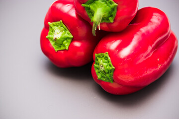 red bell pepper on gray background, food preparation process, proper nutrition