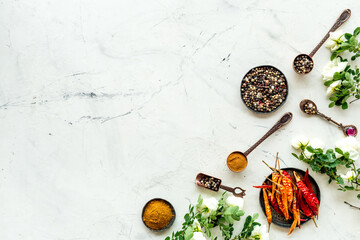 Overhead view of hot spice. Red pepper and paprika with cooking utensils