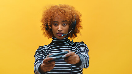 African american black woman with headset professional gamer playing video games using joystick . High quality photo © CameraCraft