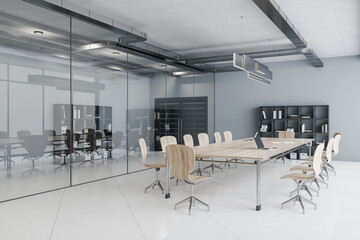 Comfortable conference interior with chairs, wooden table and bookcase.