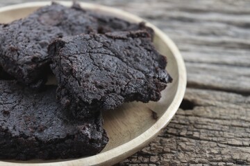 Chocolate brownies cake on wood background