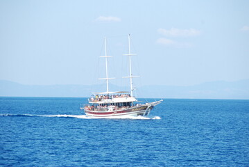 a small boat transports tourists