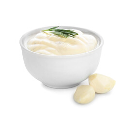 Bowl with garlic sauce on white background