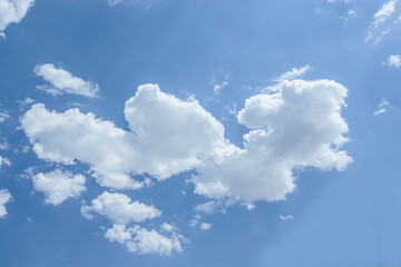 Obraz na płótnie Canvas White clouds against the blue sky. Template for wallpaper, stretch ceilings