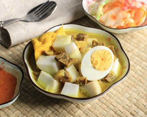 Lontong Kari Sapi, Ketupat with Beef Curry Soup. This is a Traditional Food, typically of Bandung, Indonesia.