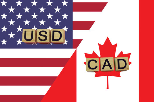 American and canadian currencies codes on national flags background