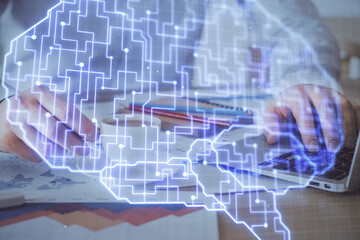 Businessman with computer background with brain theme hologram. Concept of brainstorm. Multi exposure.