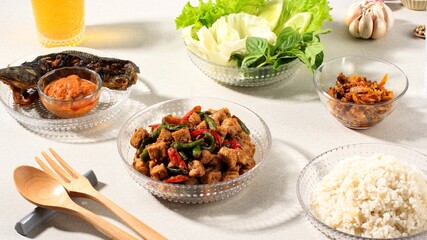 Rice, Tempe Orek, Fried Catfish, Sambal, and Fresh Vegteable on the Table. Indonesian Daily Menu, Typically Warung Tegal Dish, Cheap Popular Indonesian Restaurant