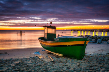 Fishing boat on the beach in Orlowo before sunrise, Gdynia. Poland