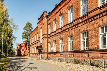 Obraz premium Beautiful vintage red brick building at sunny day