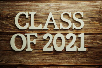 Class of 2021 word alphabet letters on wooden background