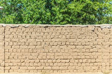 Raw clay brick fence as background