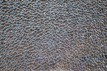 Broken tempered glass as an abstract background