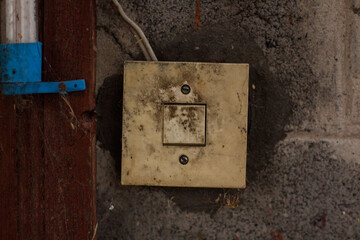 old dirty white light switch on the wall
