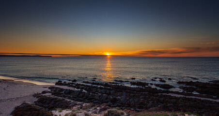 Obraz premium Sunset at Carikalinga Beach