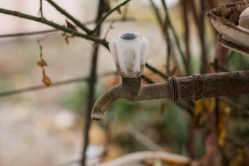 old metal crane in the village on the street