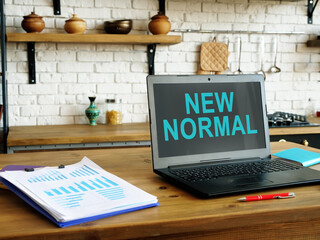New normal words on the laptop screen for work at home.