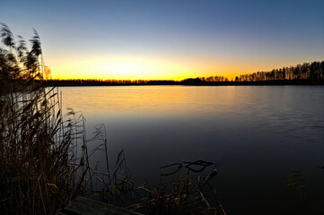 sunrise over lake in Hallabrottet Kumla Sweden in november 2020