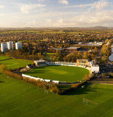 Fototapeta na wymiar Cricket ground sat centre surrounded by fields