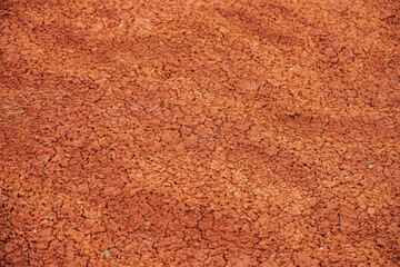 Nature background of cracked dry lands. Natural texture of soil with cracks. Broken clay surface of barren dryland wasteland close-up. Full frame to terrain with arid climate. Lifeless desert on earth