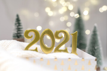 Year 2021 numbers on Golden bokeh background New year mood, Christmas, greeting card, new year background