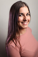 Fototapeta premium Beautiful young woman portrait, Studio shot isolated on grey background