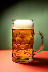 beer mug on green and red background, christmas