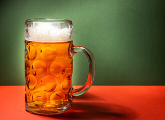 beer mug on green and red background, christmas