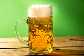 beer mug on green background