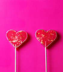 pink lollipops heart on pink background