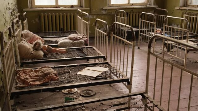 Baby cots in an abandoned kindergarten in the ghost town Pripyat in the Chernobyl exclusion zone in Ukraine 2020
