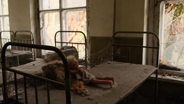 Baby cots in an abandoned kindergarten in the ghost town Pripyat in the Chernobyl exclusion zone in Ukraine 2020