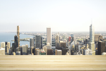 Empty tabletop made of wooden dies with Chicago city view at daytime on background, template