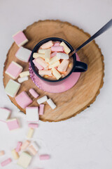 Cocoa chocolate cup with hot drink and white marshmallow on wood desk cozy background, cacao in mug on brown wooden rustic table, holiday coffee house shop, above top overhead view, copy space