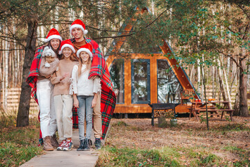 Fototapeta na wymiar Beautiful family with kids walking at Christmas day