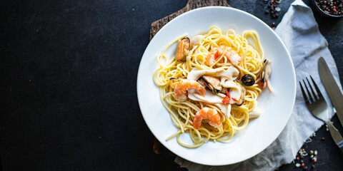 pasta seafood spaghetti shrimp, mussels and more second course healthy meal snack top view copy space for text food background