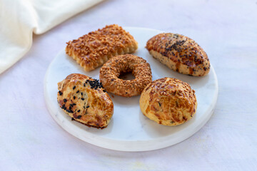 Salted pastries with cookies with sesames on serving plate