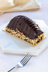 Malaga Dessert Cake / Eclair and banana in chocolate sauce