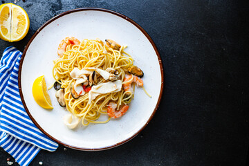 pasta seafood spaghetti shrimp, mussels and more second course healthy meal snack top view copy space for text food background