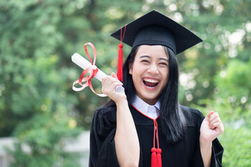happy excited college student graduating; concept of successful education, happy commencement day,...