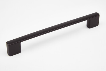 Black metallic door handle on white background