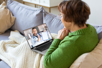 Sick senior woman at home during online cousultation with a doctor.