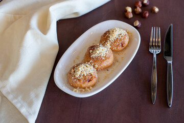 Turkish Kemalpasa Cheese Dessert / Lor Tatlisi with Pistachio Powder and Sherbet. Traditional Dessert
