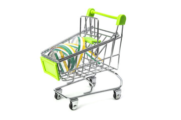 closeup on supermarket shopping cart isolated with a Irish tricolor ribbon