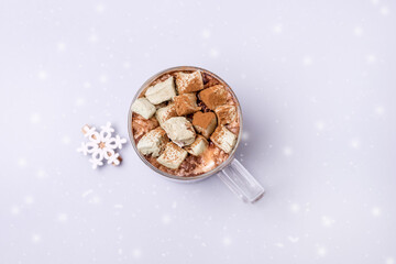 Cup Of Hot Chocolate with Homemade Marshmallows on a Light Blue background Holiday Morning Breakfast Concept Horizontal Drawing Snow