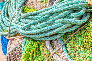 Fishing industry tools . Pile of fishing nets and ropes 