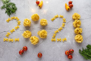 From pasta, the figures 2021 are laid out from shells, bows, as well as yellow peppers, small red...